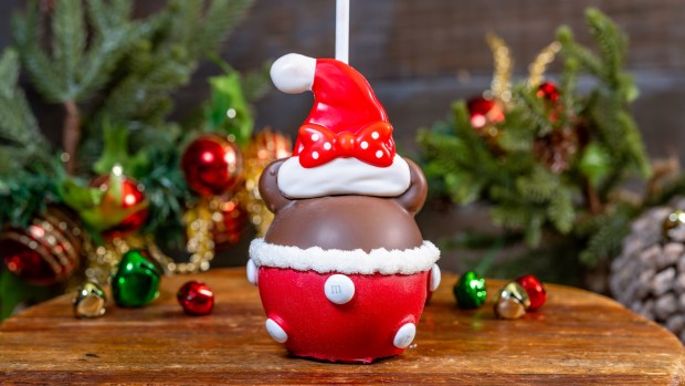 Santa Minnie Caramel Apple available at Candy Palace on the new holiday menu at Disneyland. (Courtesy of Disneyland)