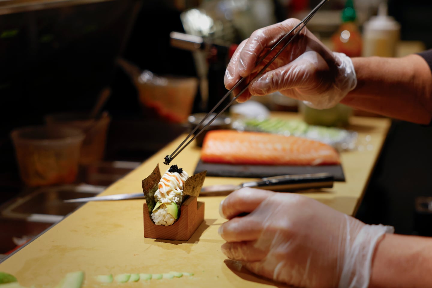 Sushi chef Sam Inthaphone prepares the butter crab hand roll at Miso Mozza in the Federal Hill neighborhood of Providence, R.I.