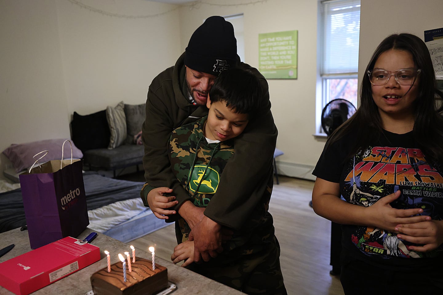Orlando Rivera Jr. sang happy birthday to his son, Daniel Librado Rivera, on his tenth birthday on Nov. 10 with his twelve-year-old daughter, Genesis Maria Rivera (right) in Holyoke.  His neighbor donated the birthday cake.