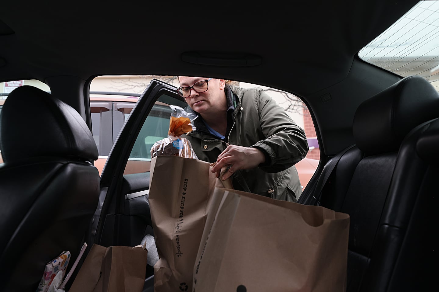 Dingman put groceries in her car. 