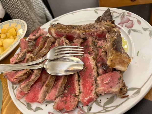 Very rare steak cut up on a plate