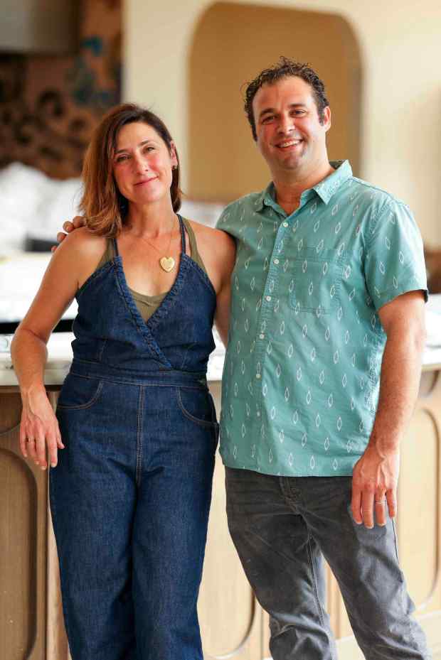Dora Ristorante's married owners Corinne Goria and Accursio Lota pose for a photo inside the restaurant on Thursday, Sept. 25, 2025 in San Diego, Califonria. (Meg McLaughlin / The San Diego Union-Tribune)