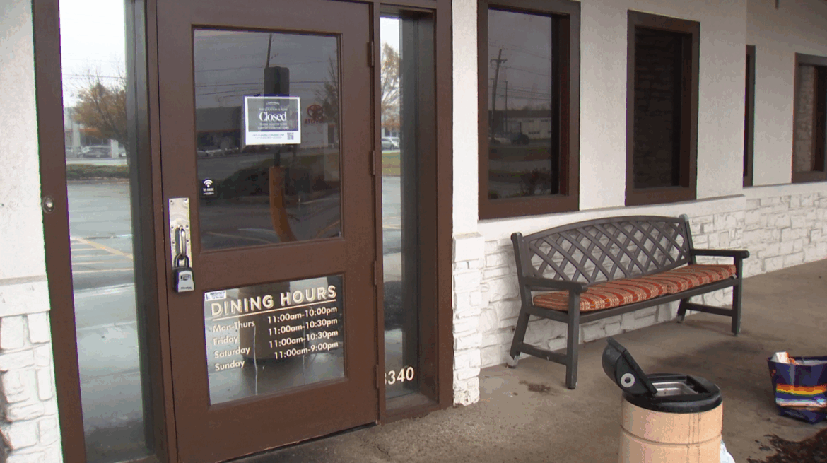 Sign on door of Carrabba's Italian Grill in Henrietta says it is now closed