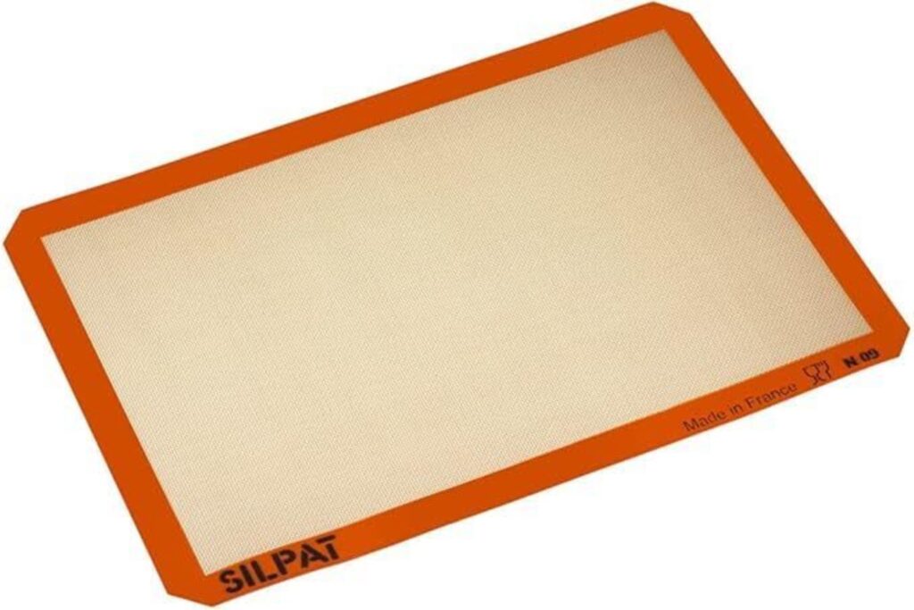 A light brown rectangle lined with brick orange that reads SILPAT Made in France.