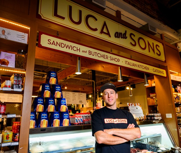 Luca Manfé, owner of Luca and Sons, stands in front...