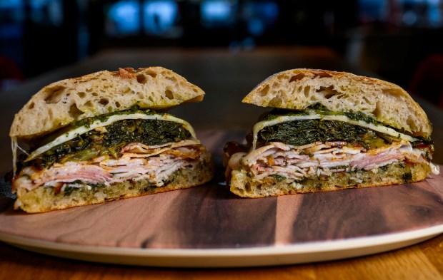 Roma, classic Italian sandwich featuring local sourdough ciabatta, porchetta, provolone,...