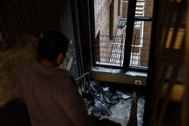 A broken window in the stairwell after a fire broke out on the third floor that left ten individuals injured, two critically, at 1166 Grand Concourse in the Bronx, Tuesday, Nov. 4, 2025. (Shawn Inglima/ New York Daily News)