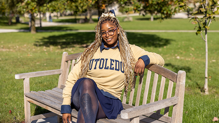 Outside portrait of junior UToledo student Tajiana Poellnitz, who returned to UToledo to earn a bachelor’s degree in Asian Studies, and hopes to open a nonprofit culinary readiness program for less-fortunate communities.