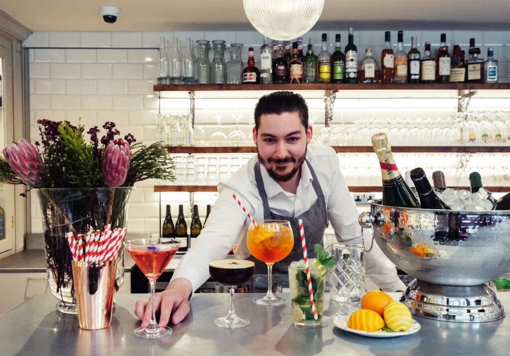 The bartender making cocktails in the restaurant