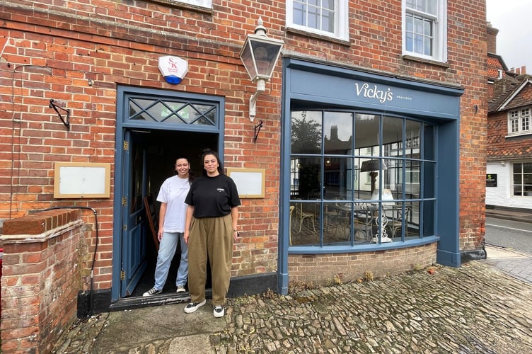 The new owners’ daughters put the finishing touches on renovations at Haslemere’s upcoming Mediterranean restaurant, set to open at the end of September