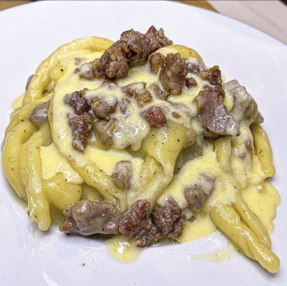 homemade cavatelli with creamed potatoes, sausage and cheese