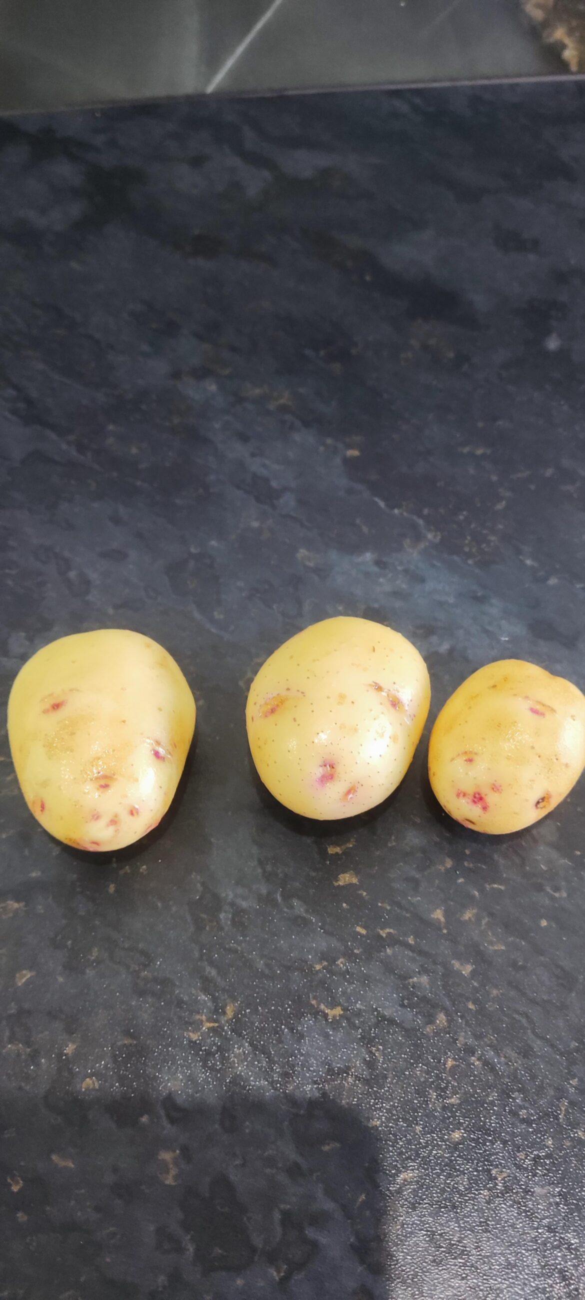 Just harvested some potatoes from my garden (UK), and it has some pink patches. Safe to eat?