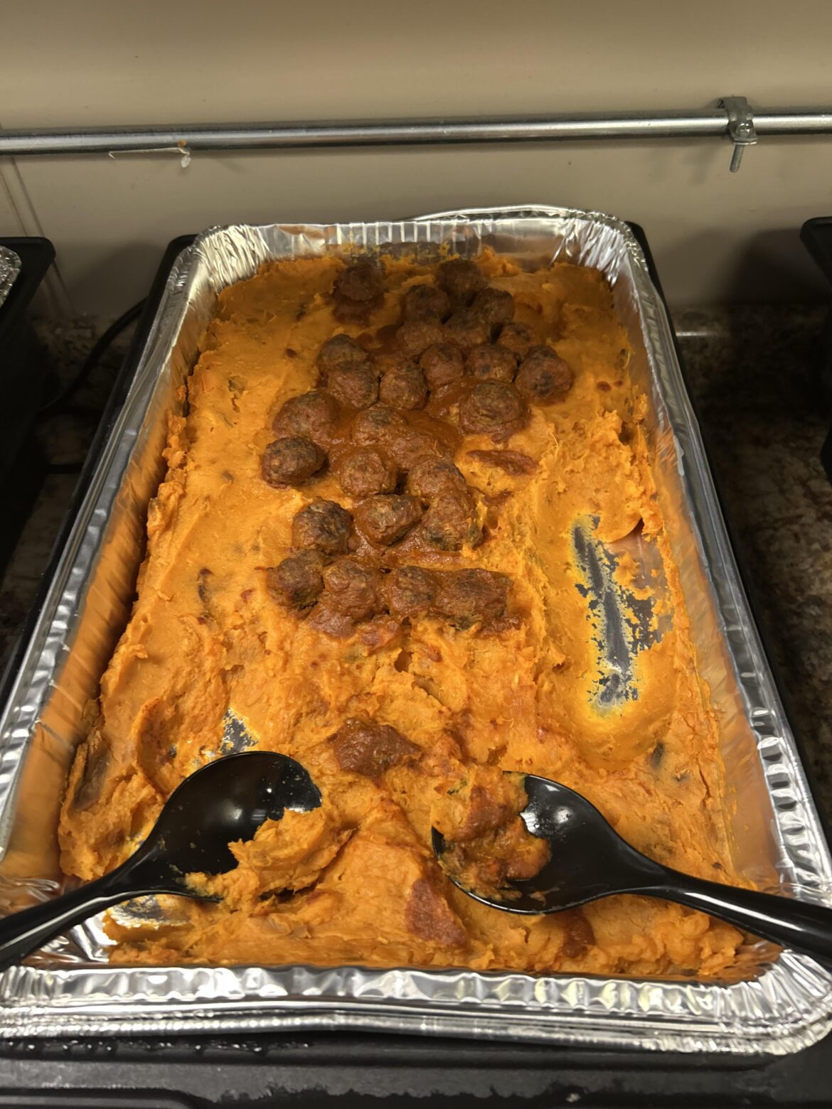 The catering company should’ve clarified that “reduce packaging” meant “mix all the individual items together”