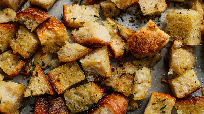 Homemade croutons on baking sheet