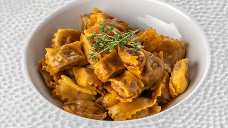 Agnolotti in sauce in bowl