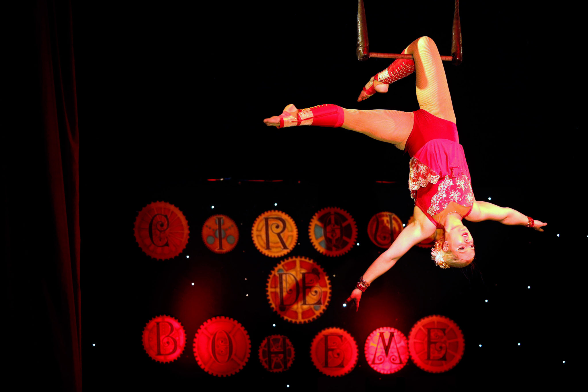 Aerialist Cola Claret performs on a static trapeze during Le Cirque de Boheme at Cornerstone Sonoma, in Sonoma. (Alvin Jornada / The Press Democrat)