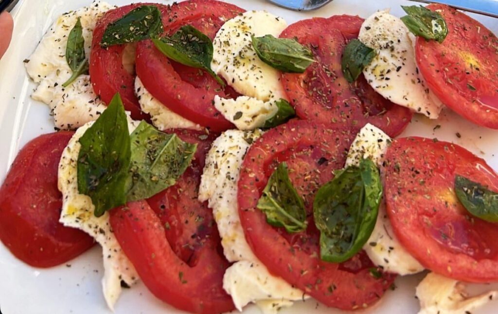 Mozzarella with tomatoes, basil and oregano