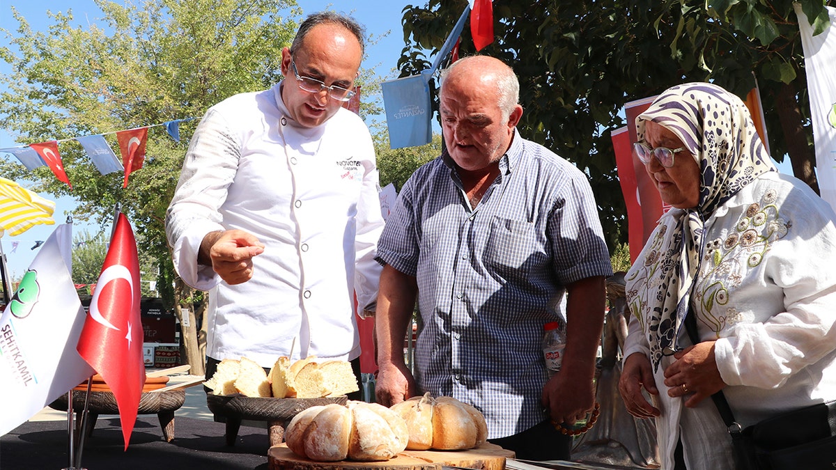 Officials admiring ancient food display