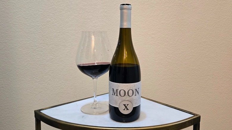 MoonX Black Pinot Noir and glass