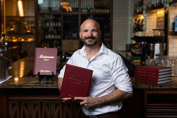 Clement Chauvin at Montrachet with his Bistronie cookbook.