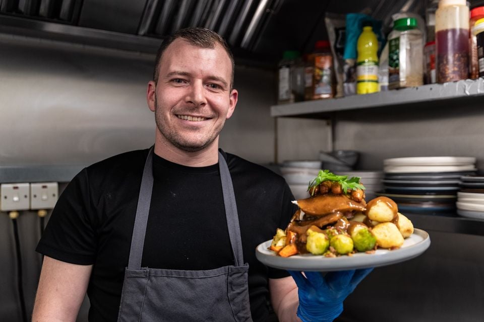 Chef John Strickland with Stacked Gourmet Sandwich Bar's offering of Christmas dinner (Luke Jervis/Belfast Telegraph)