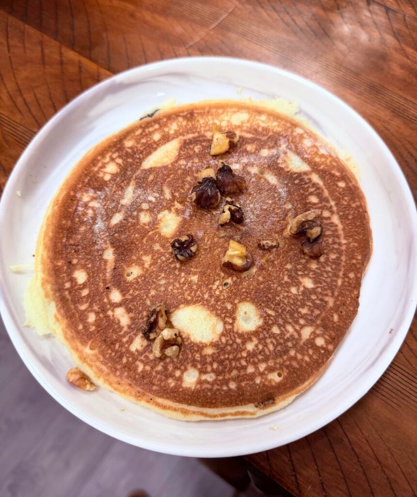 Homemade blueberry pancakes topped with toasted walnuts 😋