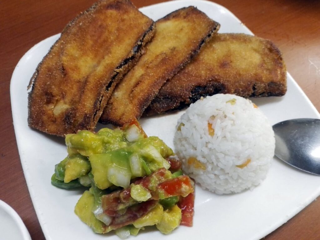 Fried eggplant with rice and avocado salad