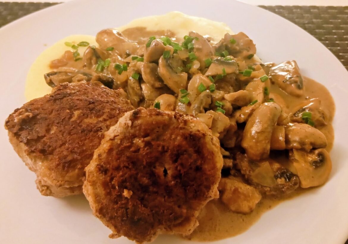 Frikadellen (german meatballs) with mushroom sauce and creamy mashed potatoes