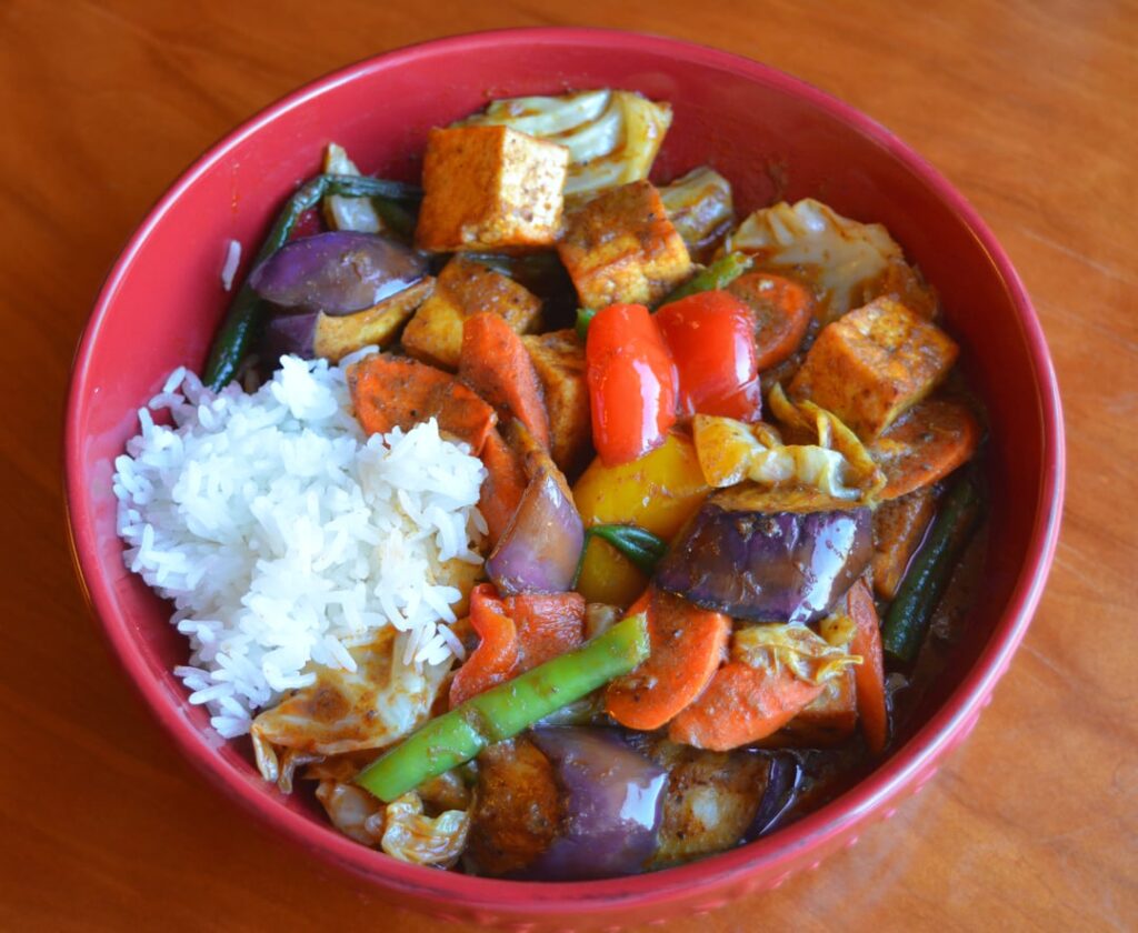 Malaysian (dry) Curry Dinner (362 cal). It has rice, tofu, eggplant, carrot, cabbage, green beans, bell pepper, coconut milk, curry paste