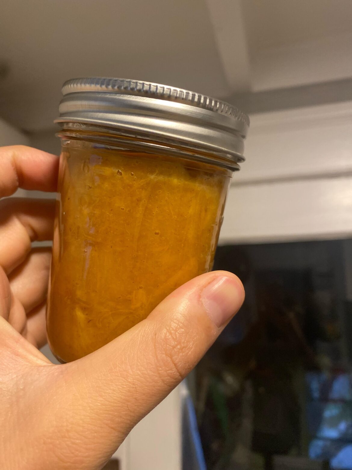 I see water on top layer of canned jam, is that okay?