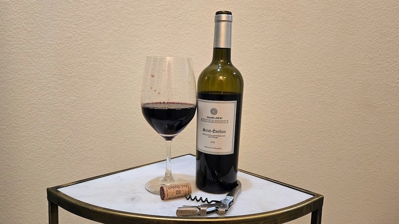 Trader Joe's Platinum Reserve Saint-Émilion Bordeaux Lot #111 next to a glass and a corkscrew