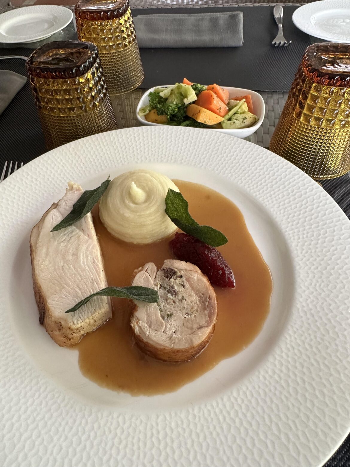 Poached Turkey Breast, Pork and Cranberry Sausage Stuffed Turkey Leg Roulade, Cranberry Relish, Pommes Puree and Jus