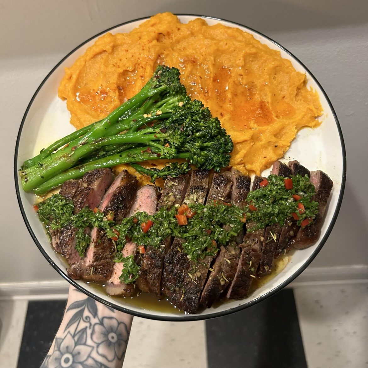 ny strip w chimichurri, chili oil broccolini, and sweet potatoes w smoked paprika + brown butter