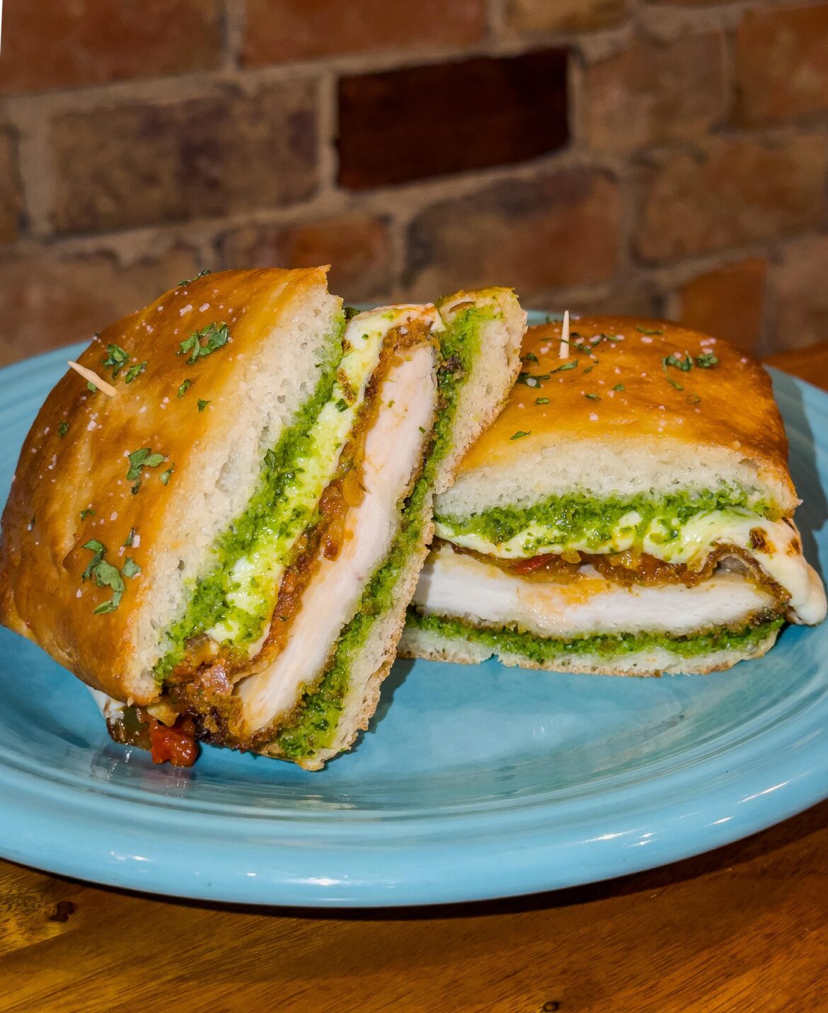 Chicken Parm Hero from scratch - baked ciabatta, spinach garlic pesto, passata with peppers, fried cutlets