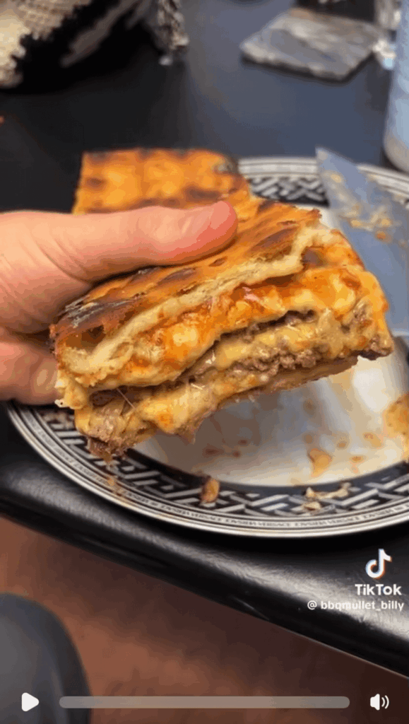 The pizza toppings were still frozen when he took it out