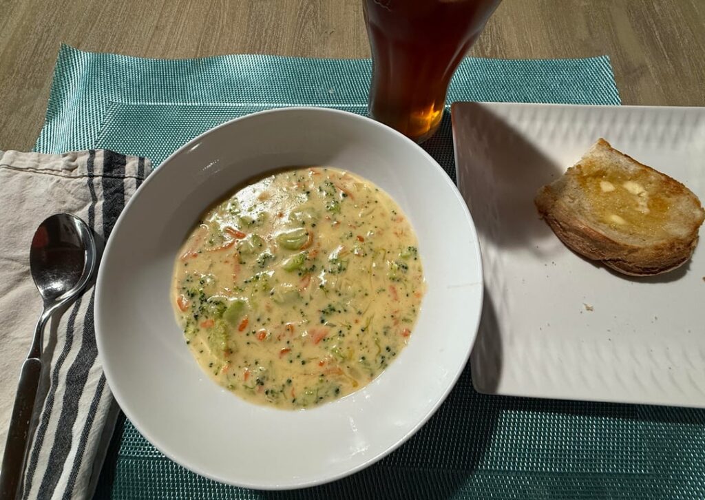 Broccoli cheddar soup with toasted sourdough bread made by a relative; on a rainy Saturday.