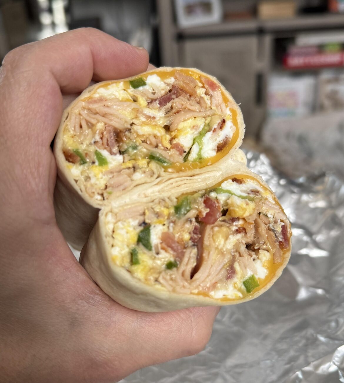 Breakfast burrito - turkey, bacon, jalapeño, avocado, american and mozzarella cheese.