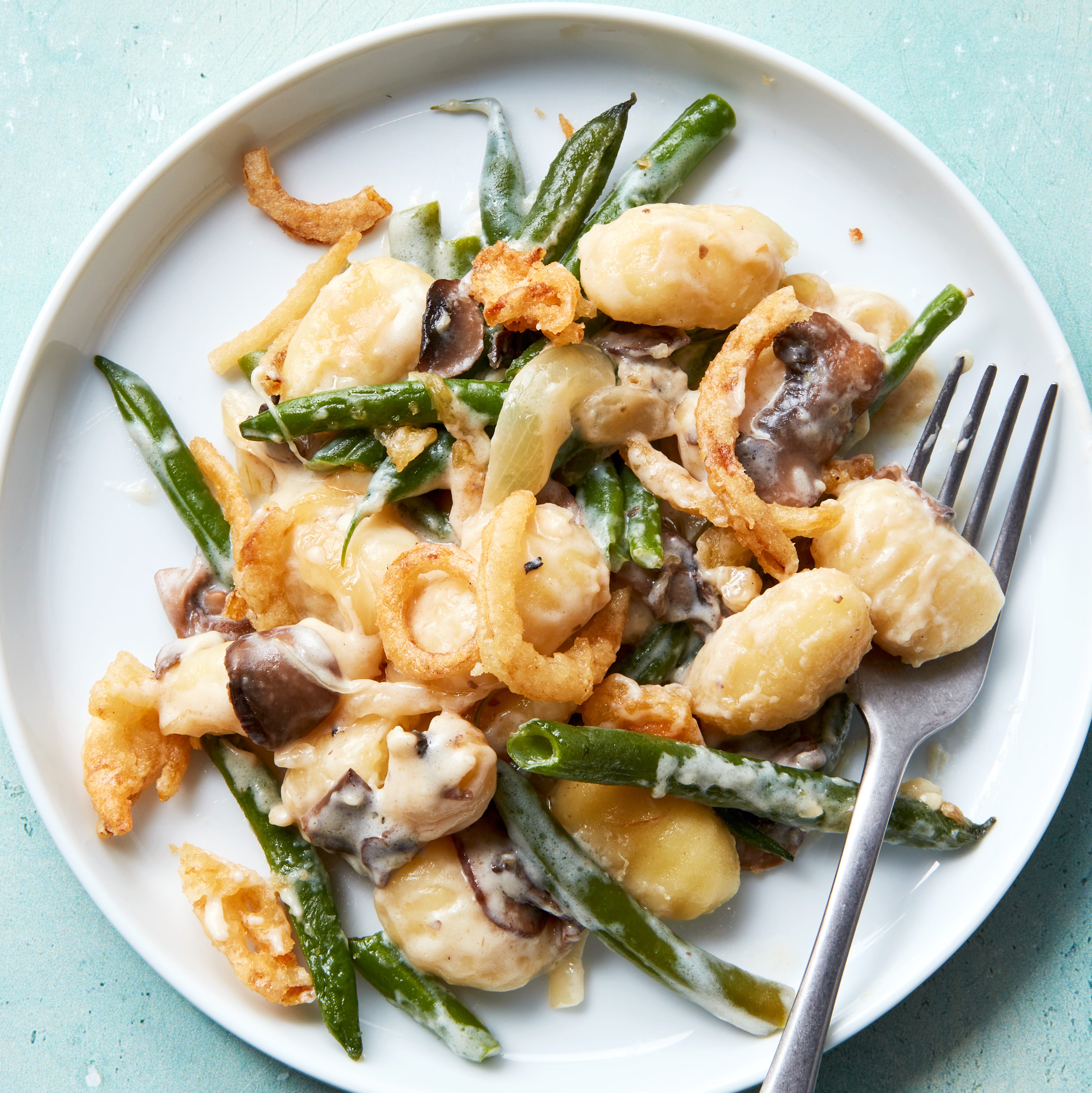 blanched fresh green beans and buttery sliced mushrooms, onions, and garlic get tossed with a creamy bechamel sauce and pillowy gnocchi then baked until bubbly