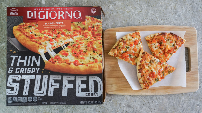 DiGiorno Frozen Thin & Crispy Stuffed Crust Margherita Pizza next to slices on cutting board