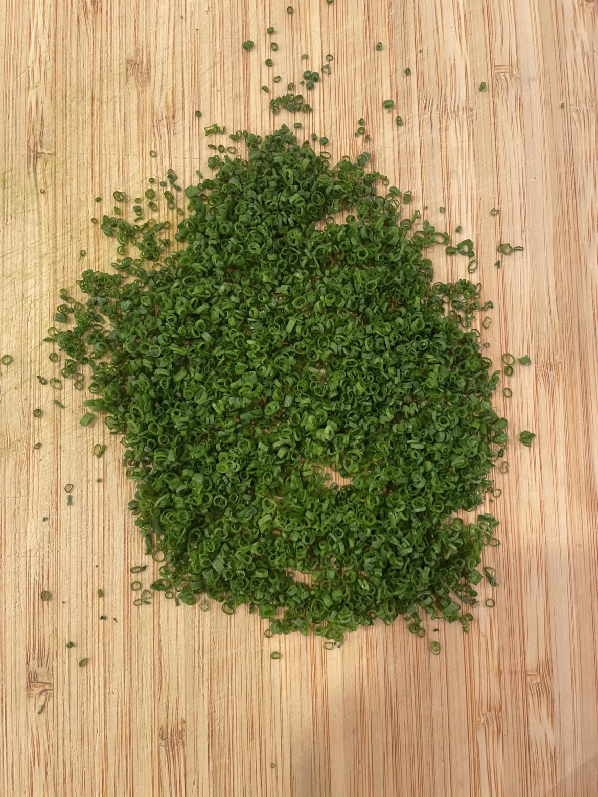 Cutting a couple of chives almost every day until this reddit says they're perfect. Day 42