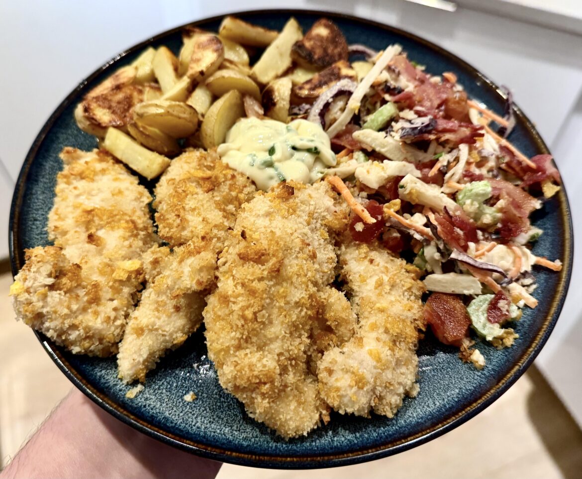 Corn Flake-Crusted Chicken Strips with Potato Wedges, Slaw and Bacon