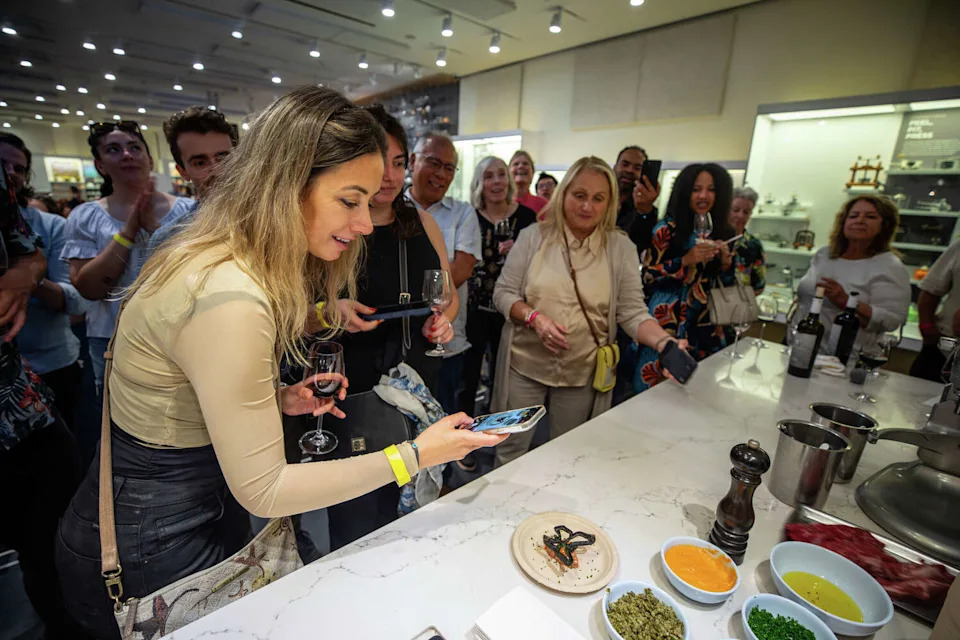 Guests photograph Troubadour Bread & Bistro's steak tartare at the San Francisco Chronicle's Wine Country's Top 25 event at the CIA at Copia in Napa on Nov. 9, 2025. (Brian Feulner/For the S.F. Chronicle)