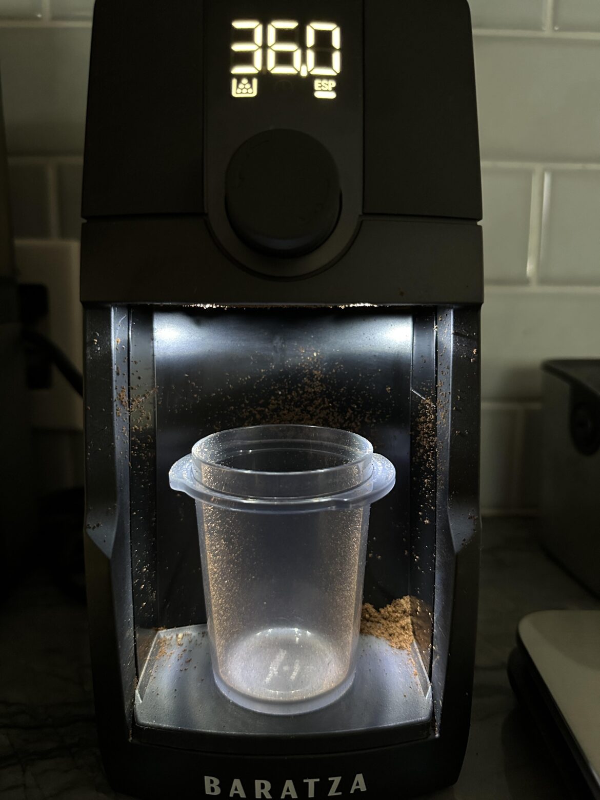 Is there a reason the cup isn’t closer to the chute to avoid making a mess?