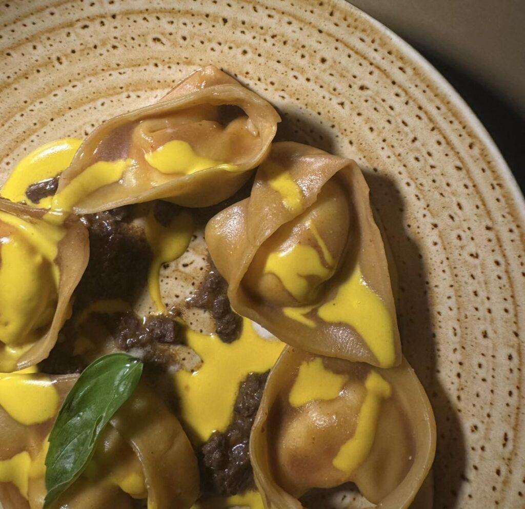 Cappellacci with meat, burrata and saffron
