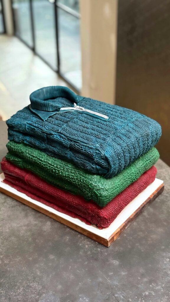 Stack of woolly jumpers cake