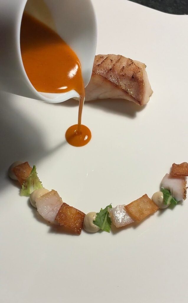 Pan seared grouper, bisque sauce, burnt cauliflower purée, xanthan crisp