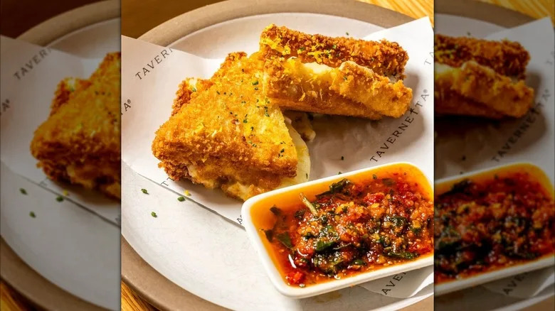 Fried mozzarella di Bufala with red pesto dipping sauce