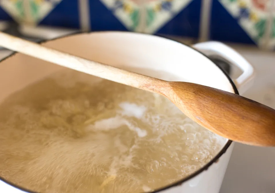 Stopping your pot from boiling over can be as easy as putting a wooden spoon across the top.