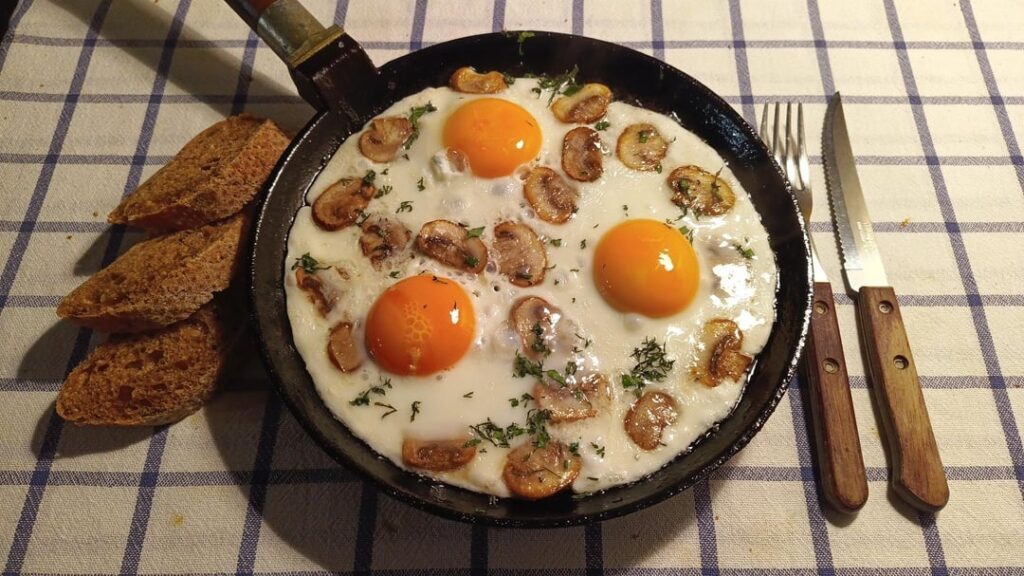 Fried eggs in a cast iron skillet — different every time, always delicious.