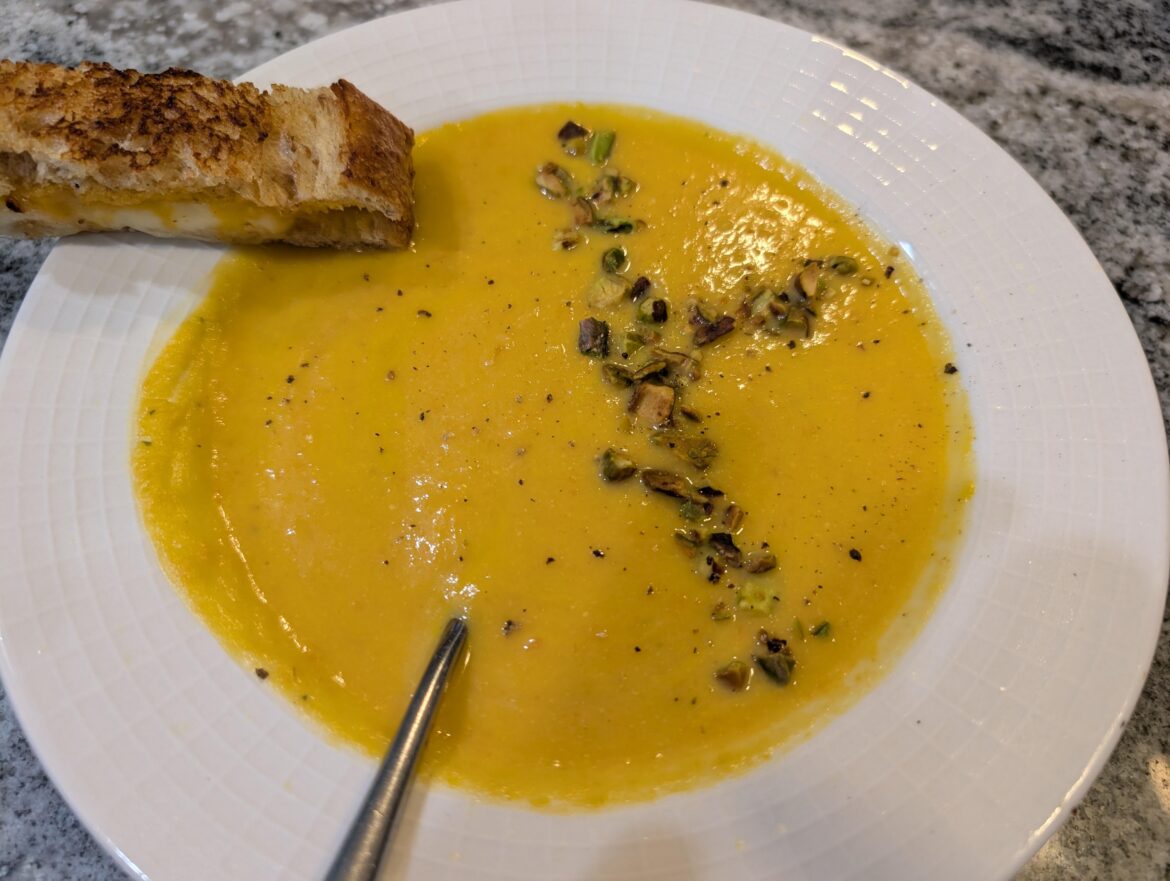 Butternut squash with roasted nuts and grilled cheese